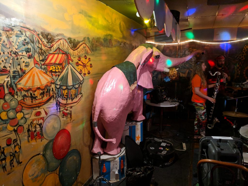 A giant pink elephant on the stage of The Carousel Lounge.