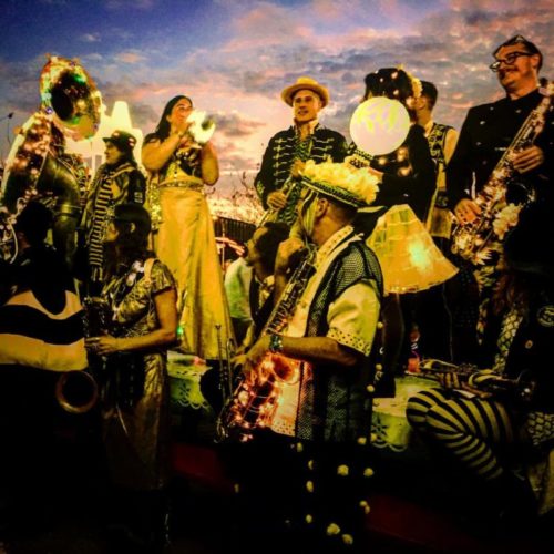 Minor Mishap Marching Band players standing in their distinctive outfits. 