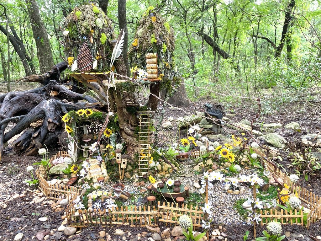 A miniature home for fairies in a garden.