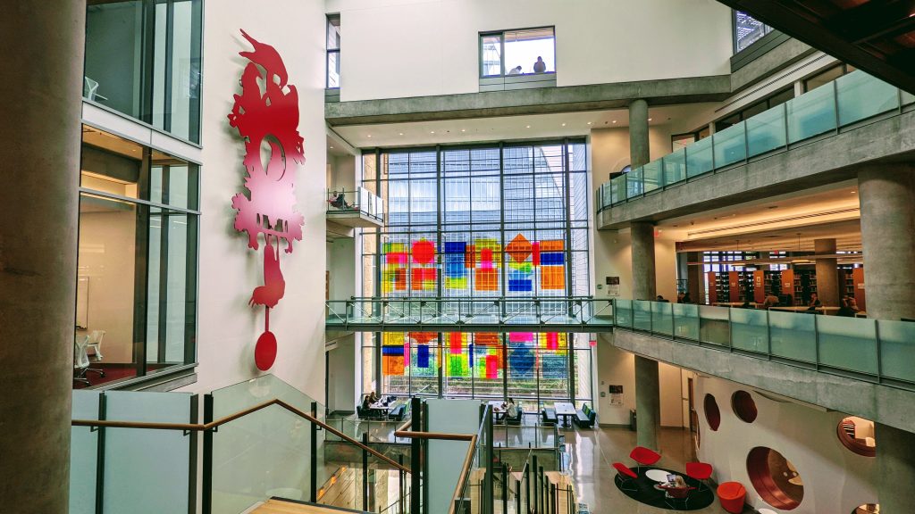 The interior of the Austin Central Library featuring a distinctive clock and a door to nowhere.